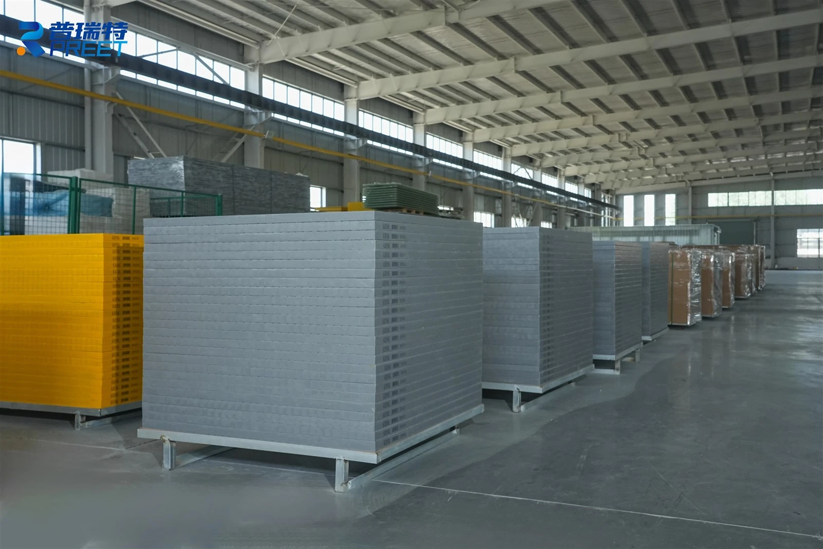 Warehouse storing finished molded FRP grating panels ready for export Warehouse storing finished molded FRP grating panels ready for export